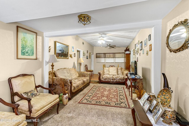 living room featuring ceiling fan and carpet