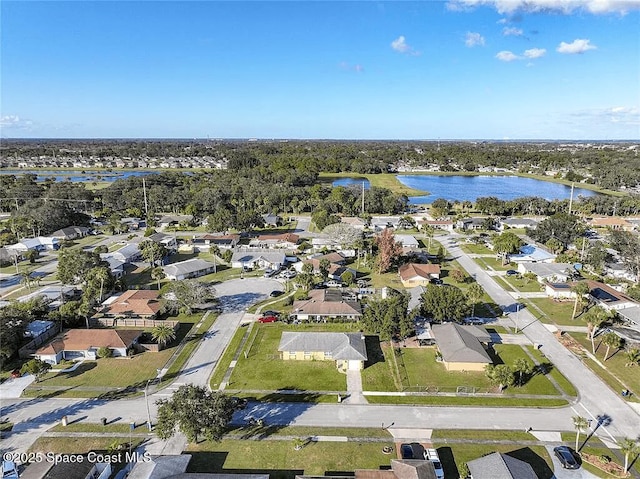 drone / aerial view with a water view