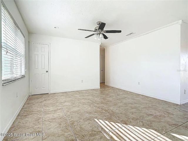 spare room with ceiling fan