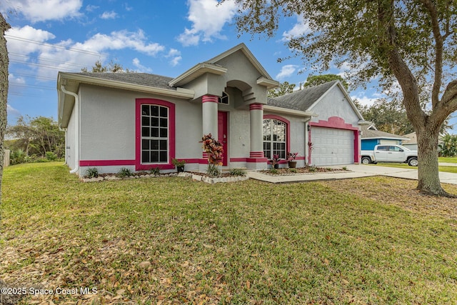 view of front of home with a garage and a front lawn