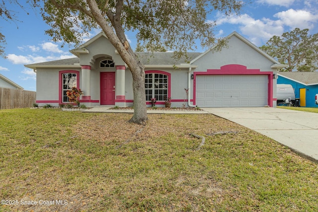 ranch-style home with a garage and a front yard