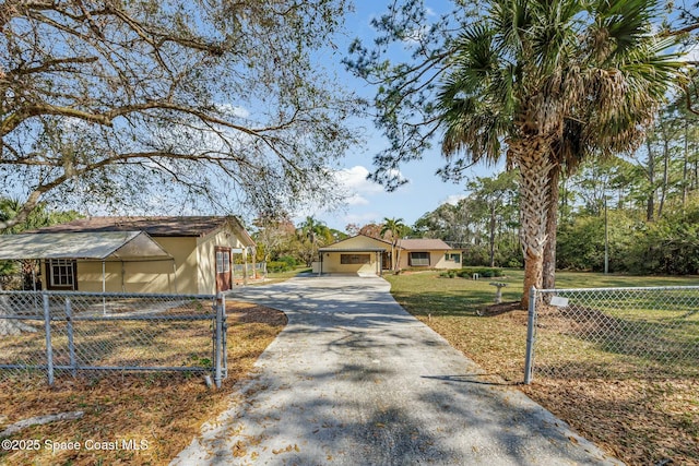 view of front of home with a garage and a front lawn