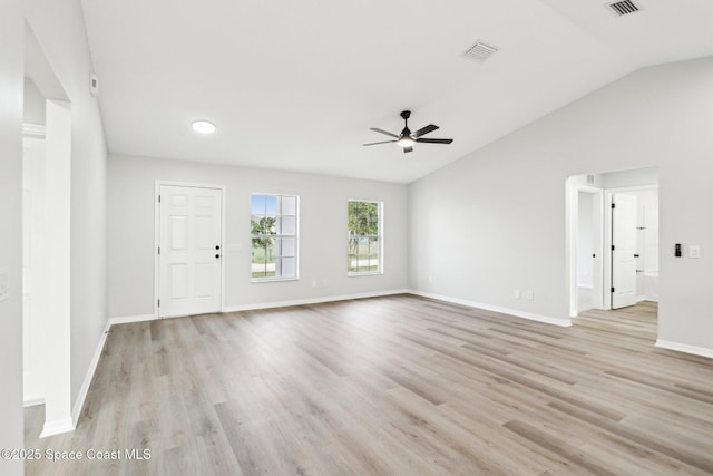 unfurnished living room featuring ceiling fan, lofted ceiling, and light hardwood / wood-style floors