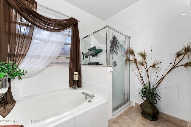 bathroom featuring separate shower and tub