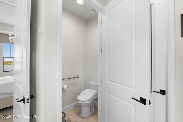 bathroom featuring toilet