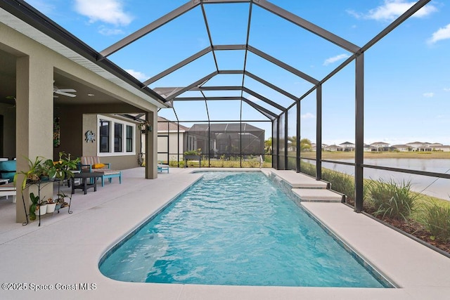 view of swimming pool with a water view, pool water feature, a lanai, and a patio