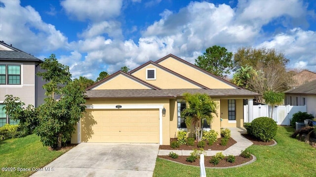 view of front of house featuring a garage and a front yard