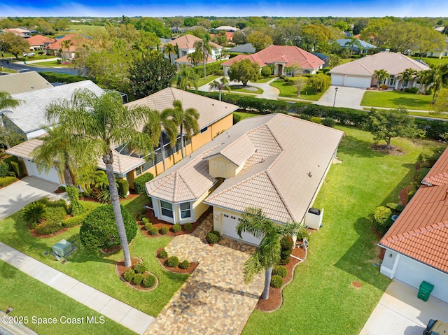 birds eye view of property with a residential view