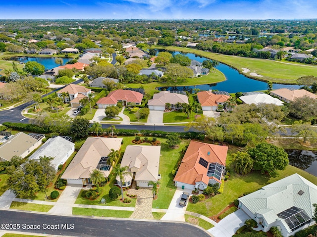 drone / aerial view featuring a water view and a residential view