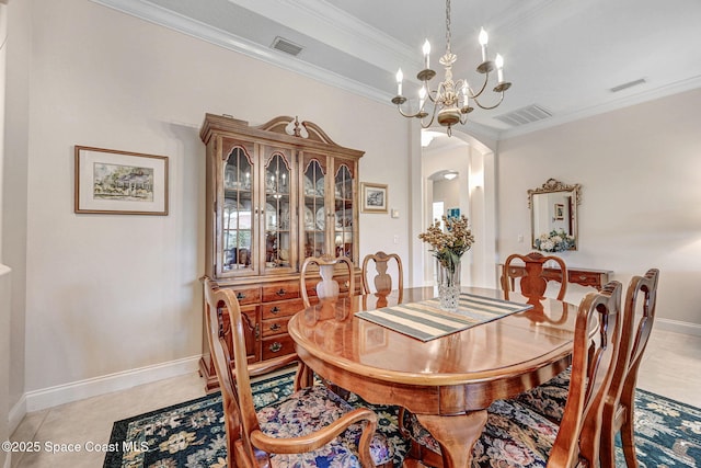 dining space with a chandelier, arched walkways, visible vents, and crown molding