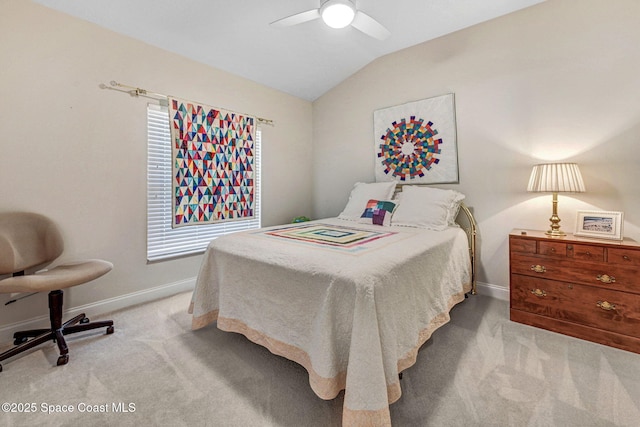 carpeted bedroom with lofted ceiling, ceiling fan, and baseboards