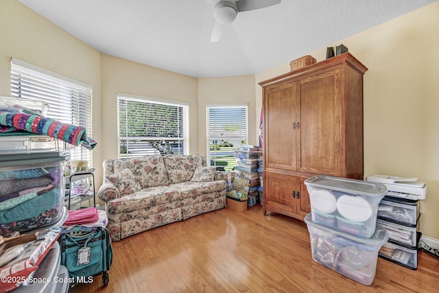 sitting room featuring ceiling fan and light wood-style flooring