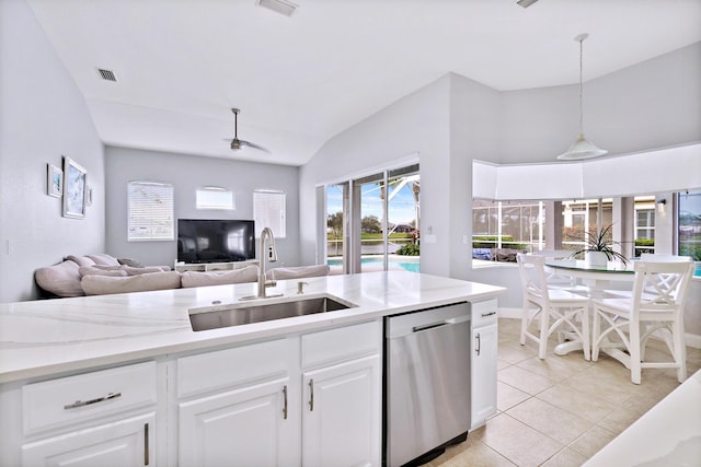 kitchen featuring light tile patterned flooring, sink, stainless steel dishwasher, pendant lighting, and white cabinets