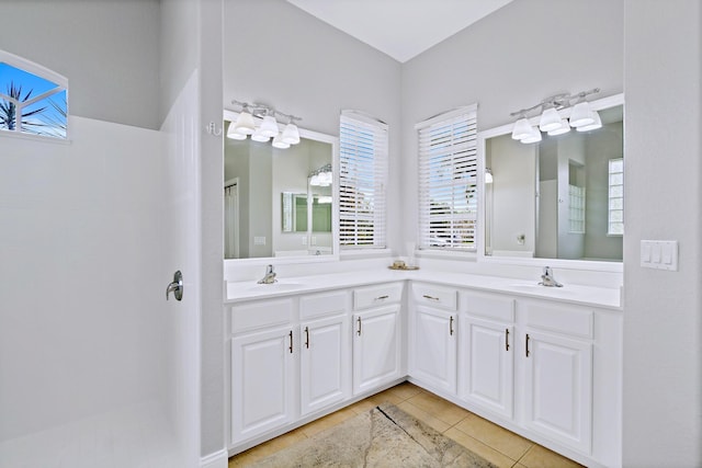 bathroom featuring tile patterned flooring and vanity