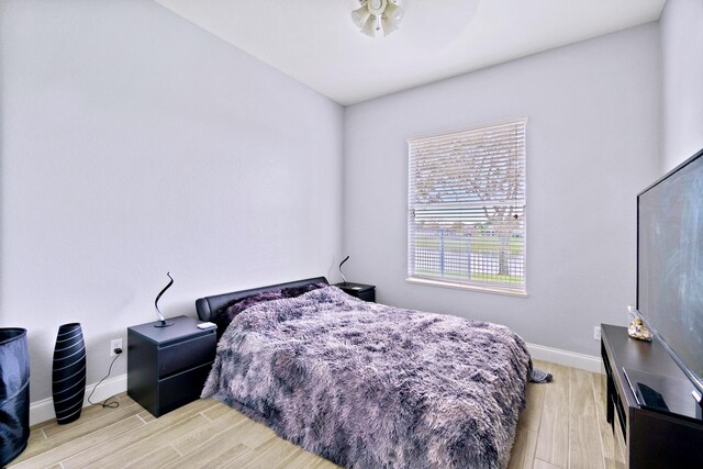 bedroom with light hardwood / wood-style floors