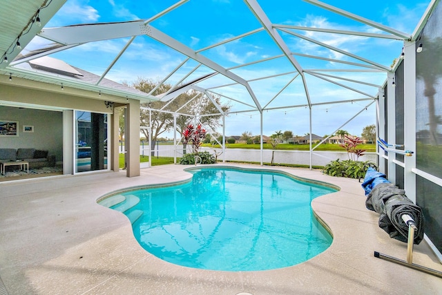 view of swimming pool with a lanai, a patio area, and a water view