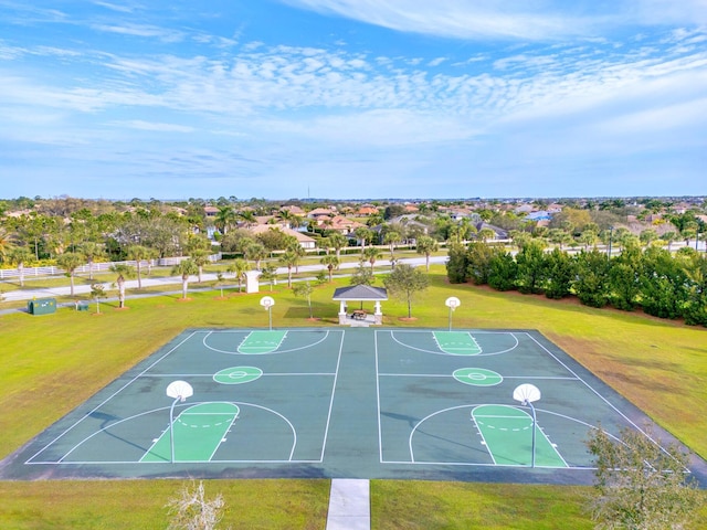 view of basketball court with a lawn