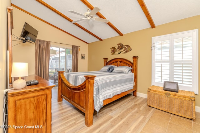 bedroom with light hardwood / wood-style floors, vaulted ceiling with beams, access to exterior, and a textured ceiling