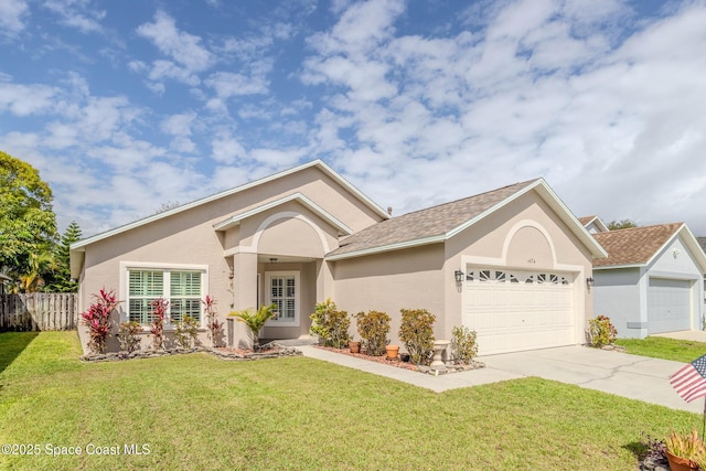 ranch-style house featuring a front yard and a garage