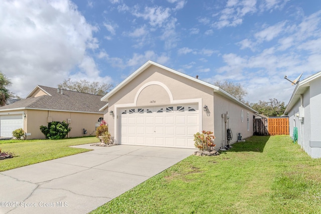 ranch-style house with a garage and a front lawn