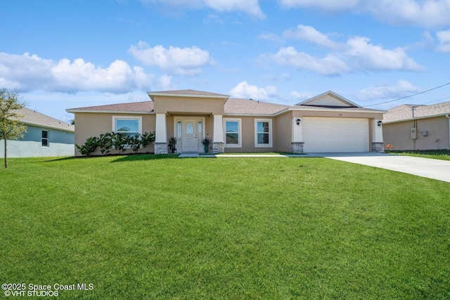 view of front facade with a front yard, a garage, driveway, and stucco siding