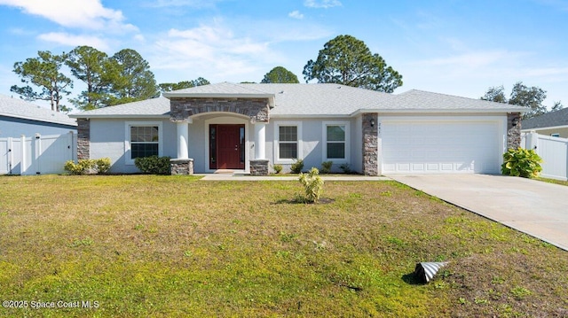 view of front facade featuring a garage, central AC, and a front yard