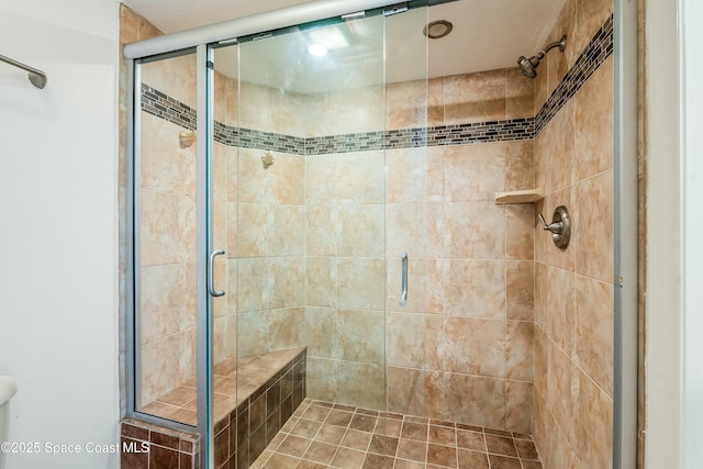 bathroom with a shower with shower door