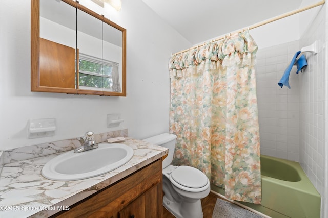 full bathroom with vanity, shower / bath combination with curtain, and toilet