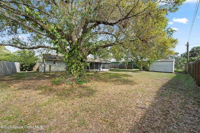 view of yard with a storage unit