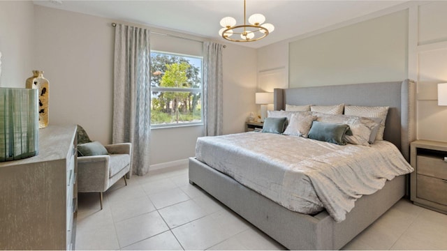 bedroom featuring light tile patterned floors, baseboards, and an inviting chandelier