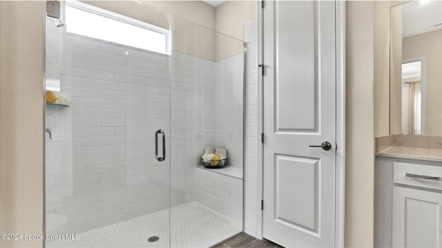 bathroom featuring a shower with door