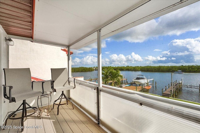 wooden deck with a water view