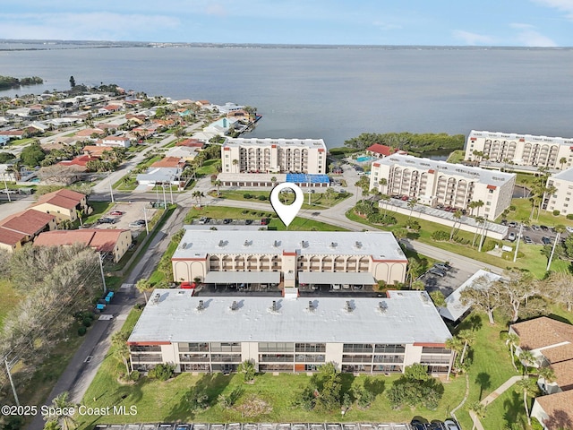 bird's eye view featuring a city view and a water view