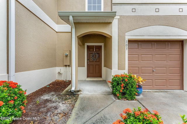 entrance to property featuring a garage