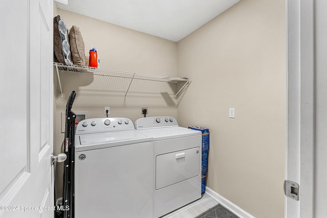 laundry room with washer and dryer