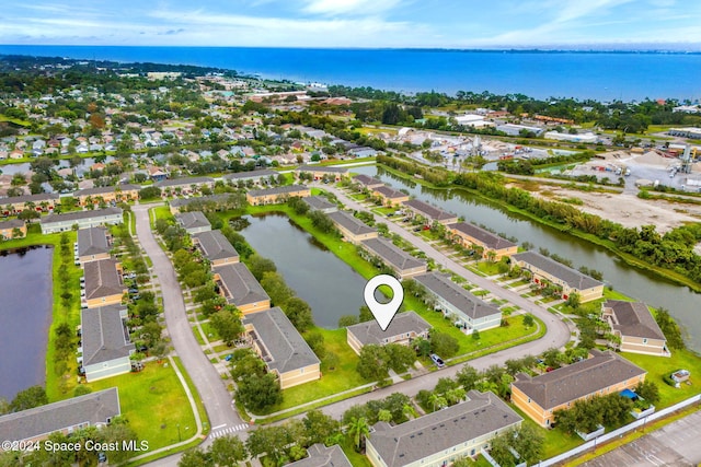 drone / aerial view with a water view