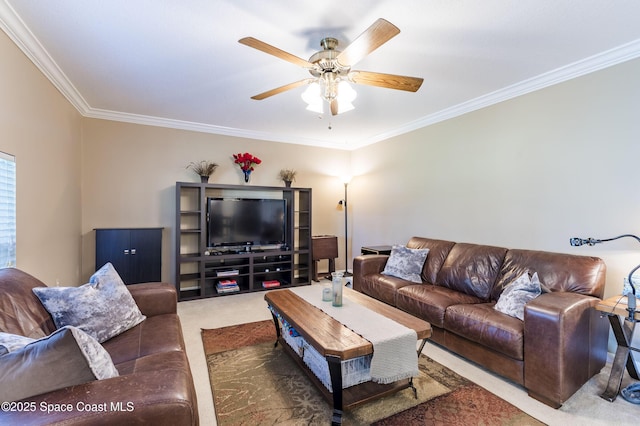 carpeted living room with ceiling fan and ornamental molding