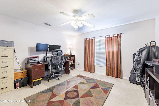 carpeted office with ceiling fan