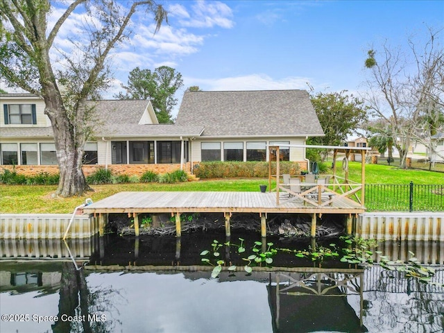 back of house with a water view