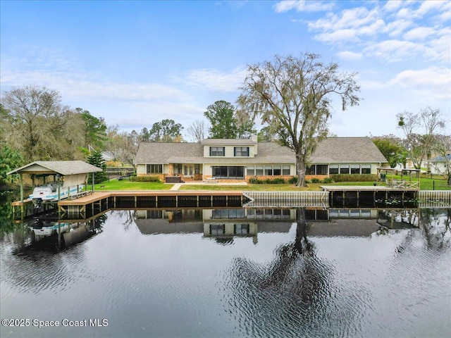 rear view of house with a water view