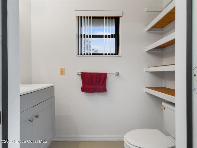 bathroom featuring vanity and toilet