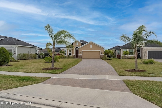 ranch-style house with a garage and a front lawn