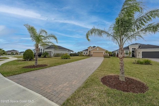 view of front of home with a garage and a front yard