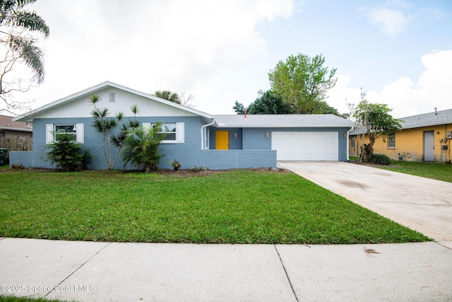 single story home with a garage and a front lawn