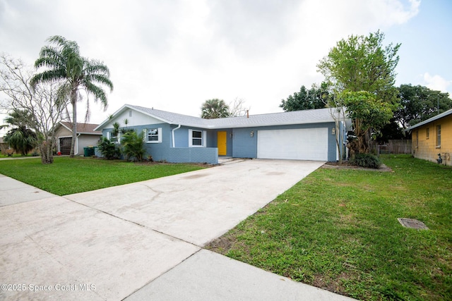 single story home featuring a garage and a front yard