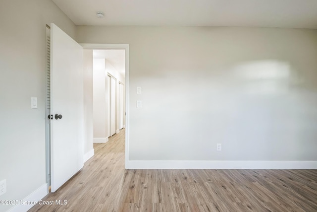 empty room with light hardwood / wood-style floors