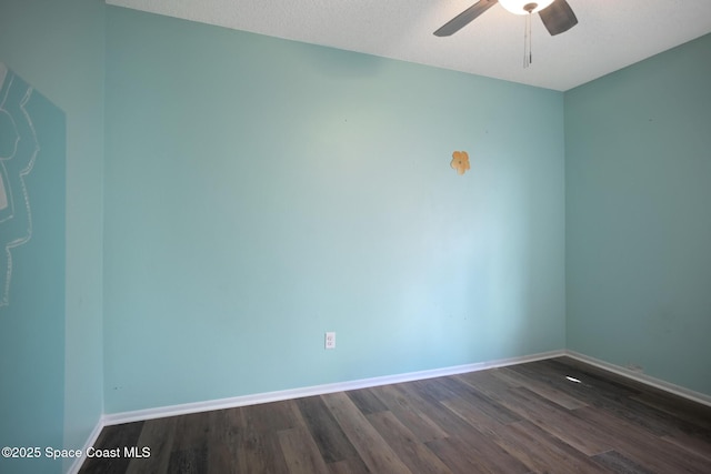 unfurnished room with dark hardwood / wood-style floors, a textured ceiling, and ceiling fan