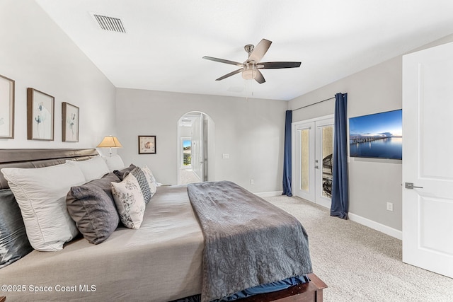 bedroom featuring light carpet, access to exterior, and ceiling fan