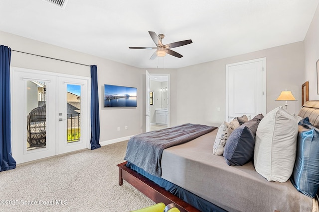 bedroom featuring connected bathroom, light colored carpet, access to exterior, ceiling fan, and french doors