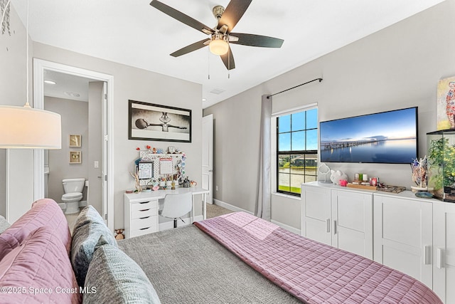 bedroom featuring ensuite bathroom and ceiling fan